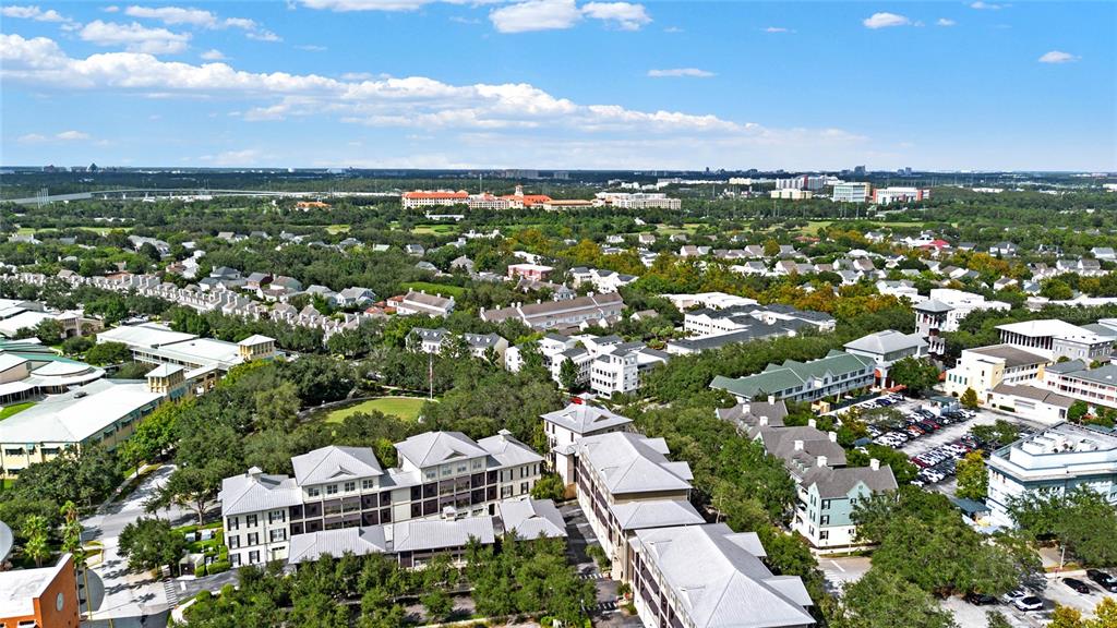 720 Celebration Avenue, Unit 220 Celebration, FL 34747 - Photo 27 of 45 an aerial view of residential building with outdoor space and trees