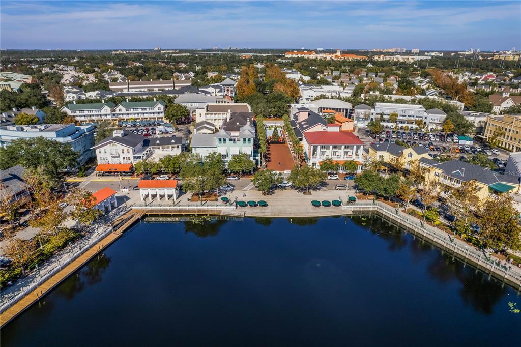 720 Celebration Avenue, Unit 220 Celebration, FL 34747 - Photo 44 of 45 an aerial view of residential building and lake