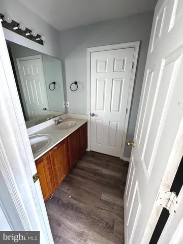 a bathroom with a sink a mirror and a bathtub