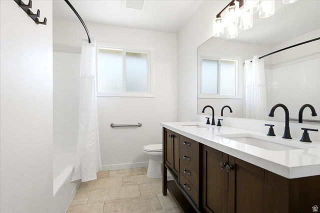 1676 East 11245 South Sandy, UT 84092 - Photo 24 of 34 Double vanity with a white countertop and matte black faucets