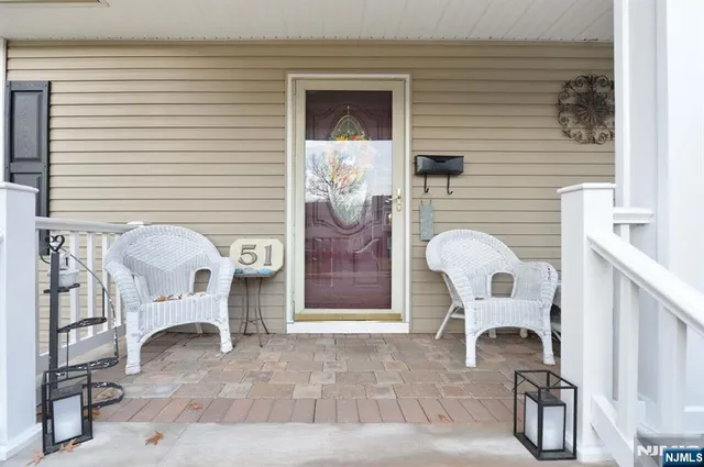 a view of a door and chair in the patio
