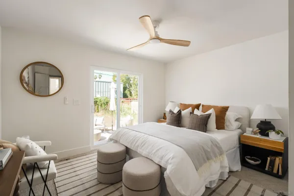 a bedroom with a bed and a window
