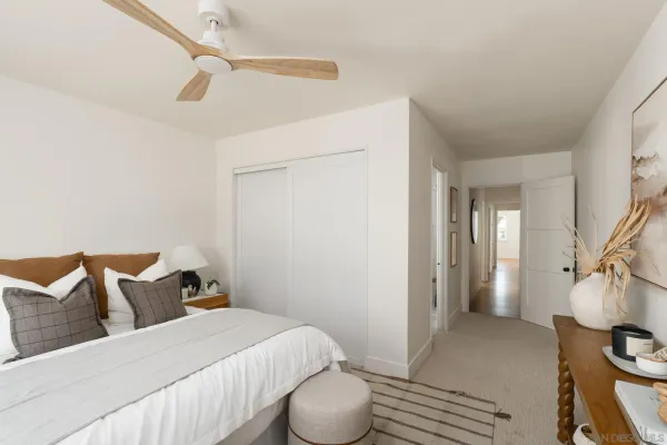 a bedroom with a bed and cabinets