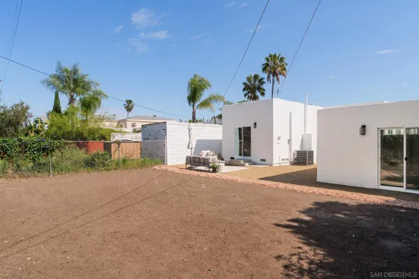 a view of a house with a yard and garage