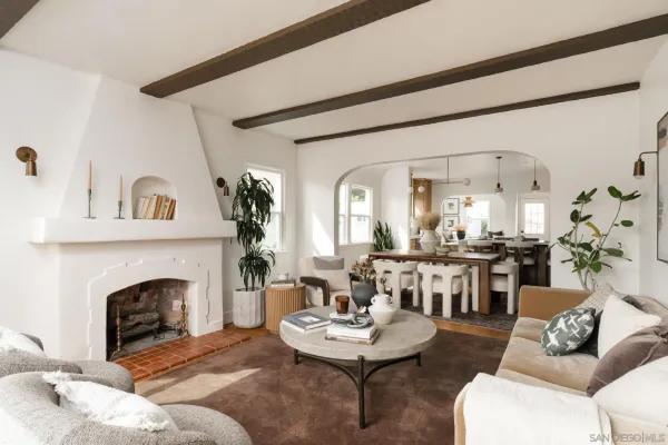 a living room with furniture and a fireplace