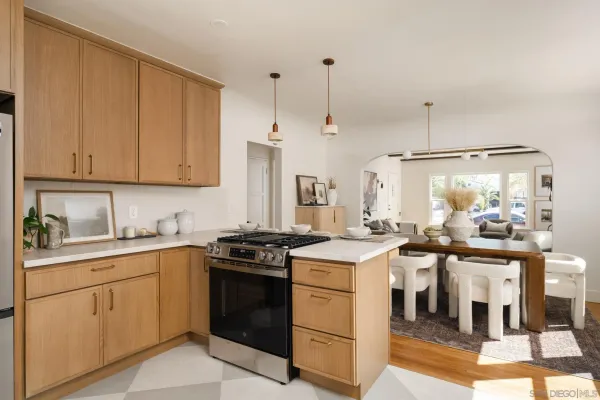 a kitchen with a stove top oven sink and cabinets