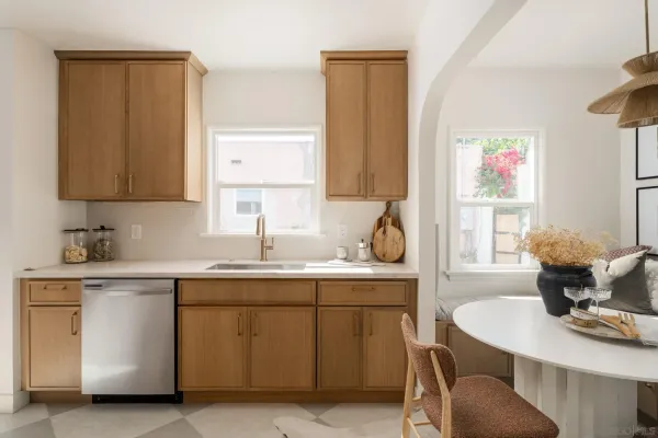 a kitchen with a sink cabinets and window