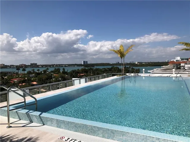 a room with gym equipment and a large window