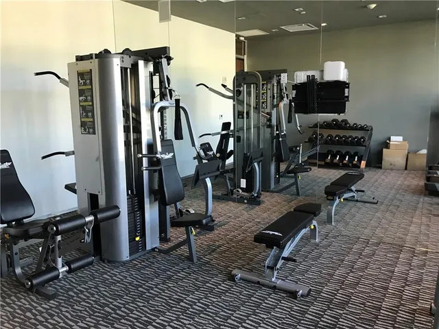 a kitchen with a dining table chairs and view of kitchen