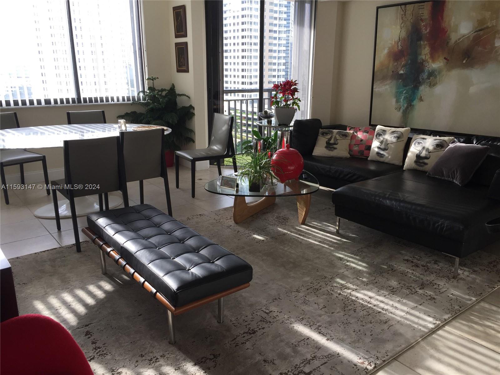 540 Brickell Key Drive, Unit 1511 Miami, FL 33131 - Photo 13 of 24 a living room with furniture and a potted plant