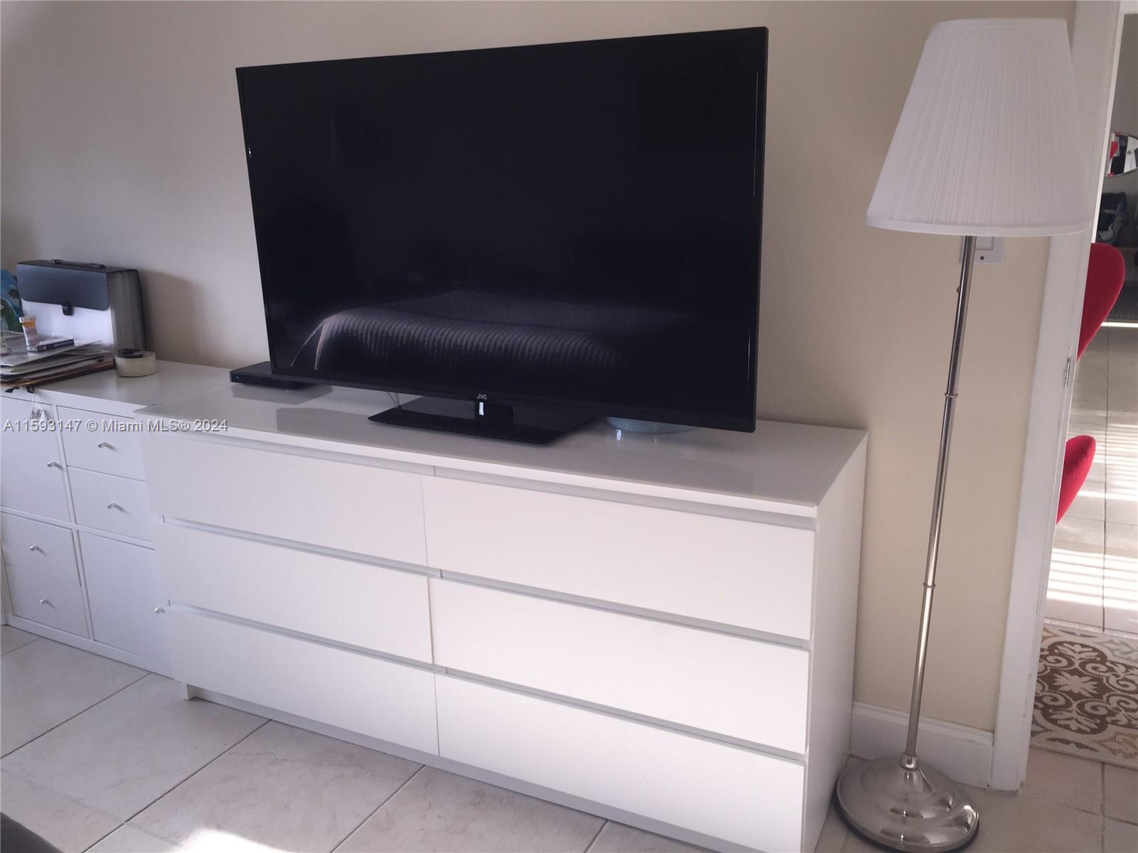 540 Brickell Key Drive, Unit 1511 Miami, FL 33131 - Photo 19 of 24 a bathroom with a sink and a mirror