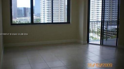 540 Brickell Key Drive, Unit 1511 Miami, FL 33131 - Photo 2 of 24 a view of hallway with a window