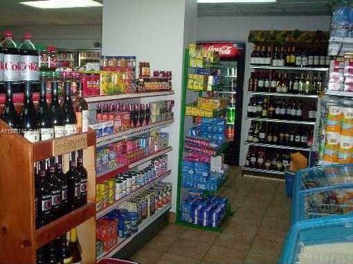 540 Brickell Key Drive, Unit 1511 Miami, FL 33131 - Photo 8 of 24 a store room with lots of different kinds of wine