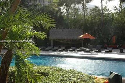 540 Brickell Key Drive, Unit 1511 Miami, FL 33131 - Photo 9 of 24 a backyard of a house with yard and outdoor seating