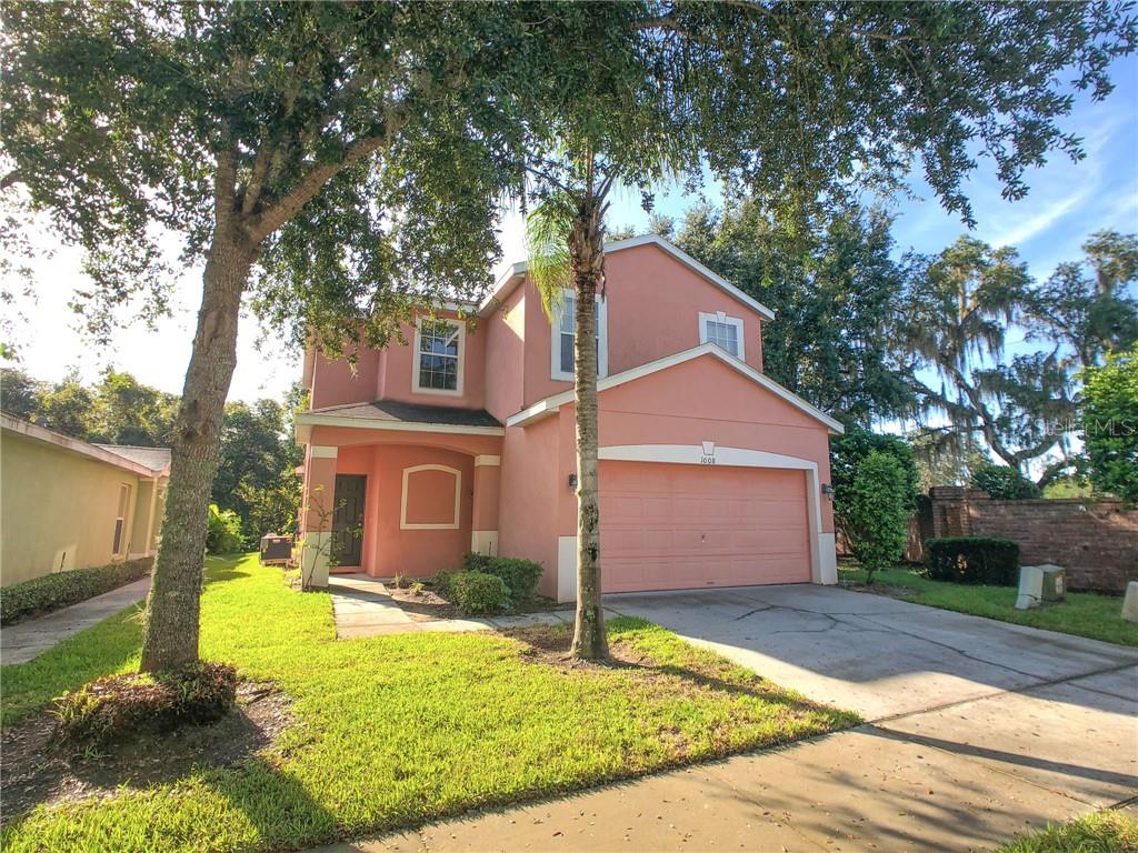 1008 Royal Ridge Drive Davenport, FL 33896 - Photo 1 of 1 a front view of a house with a yard and garage