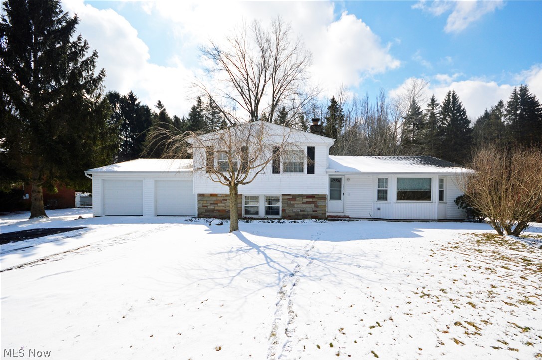 5966 Chapel Road Madison, OH 44057 - Photo 1 of 15 Well built Split-Level backs up to woods for a sense of seclusion.