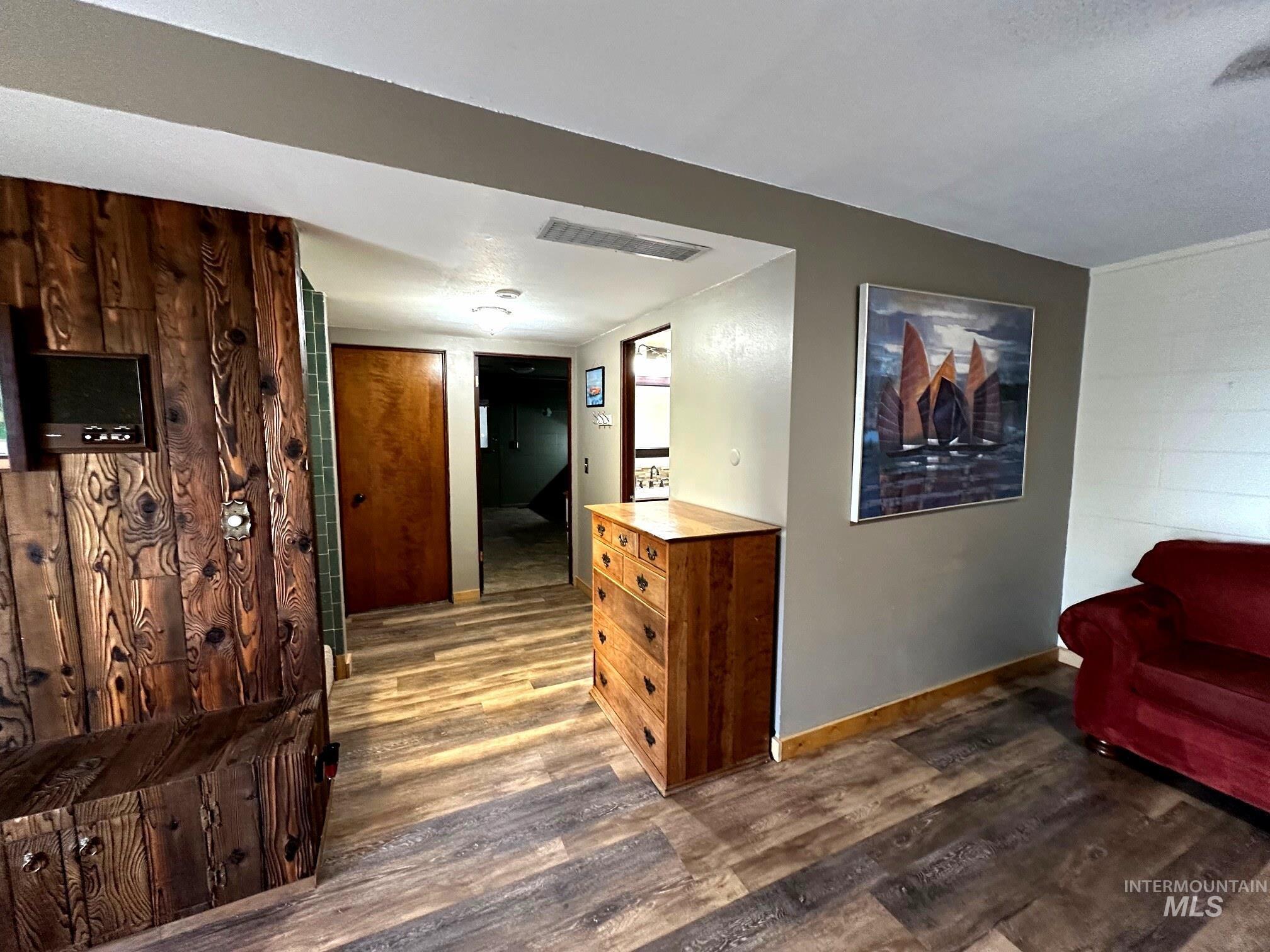 4436 Baker Road Ontario, OR 97914 - Photo 25 of 30 Hall featuring dark wood-style floors and a textured ceiling