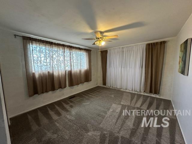 4436 Baker Road Ontario, OR 97914 - Photo 38 of 41 Spare room with dark carpet and ceiling fan