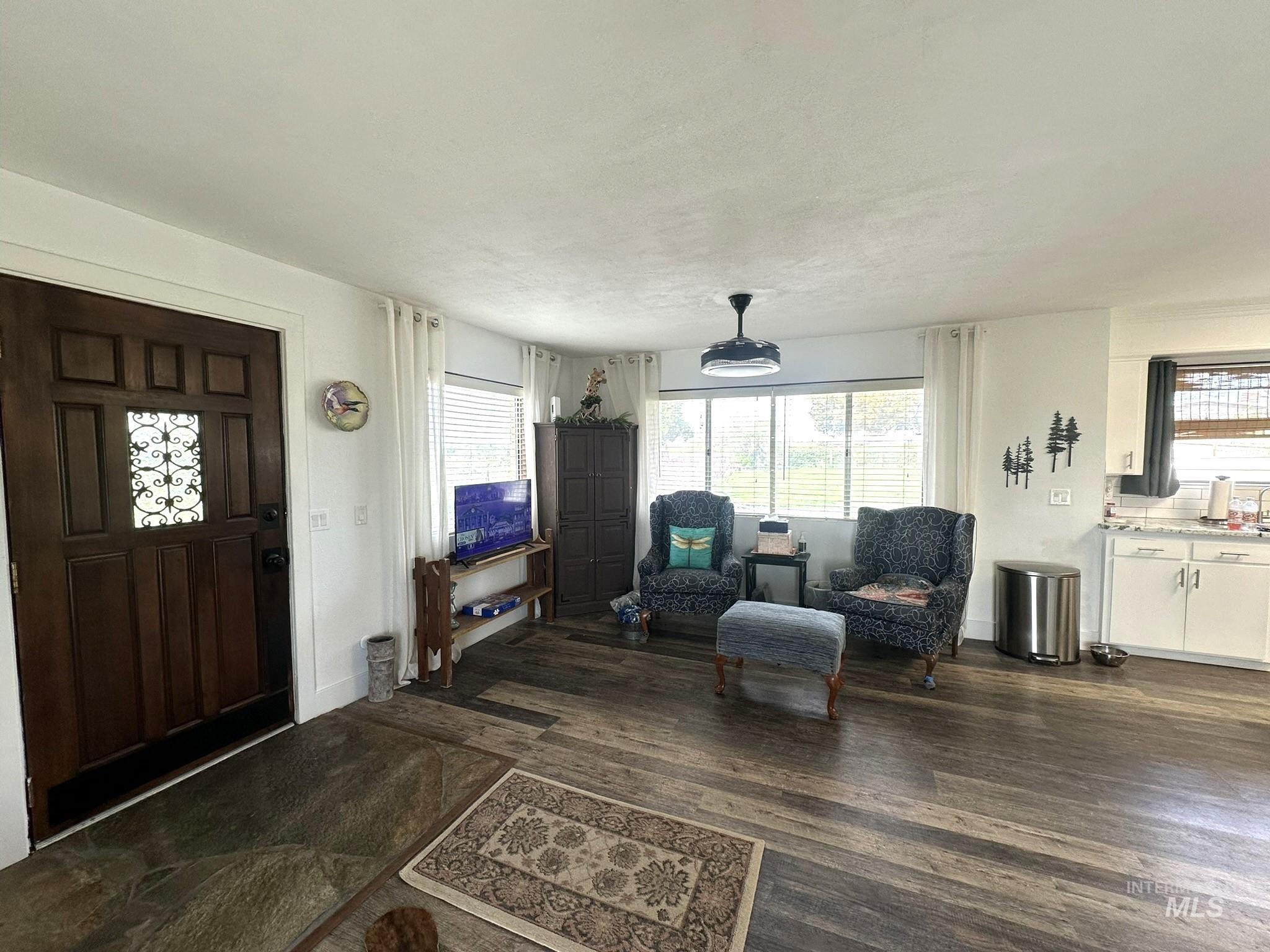4436 Baker Road Ontario, OR 97914 - Photo 5 of 30 Living area featuring dark wood-type flooring and plenty of natural light