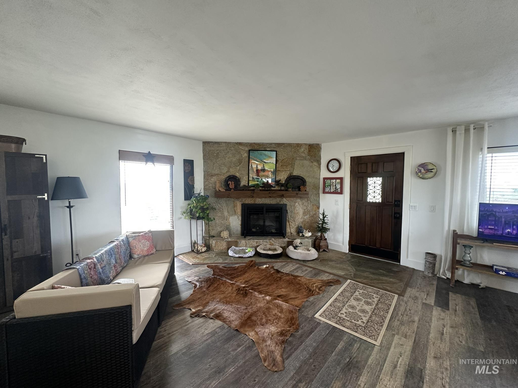 4436 Baker Road Ontario, OR 97914 - Photo 9 of 30 Living area with dark wood finished floors and a fireplace