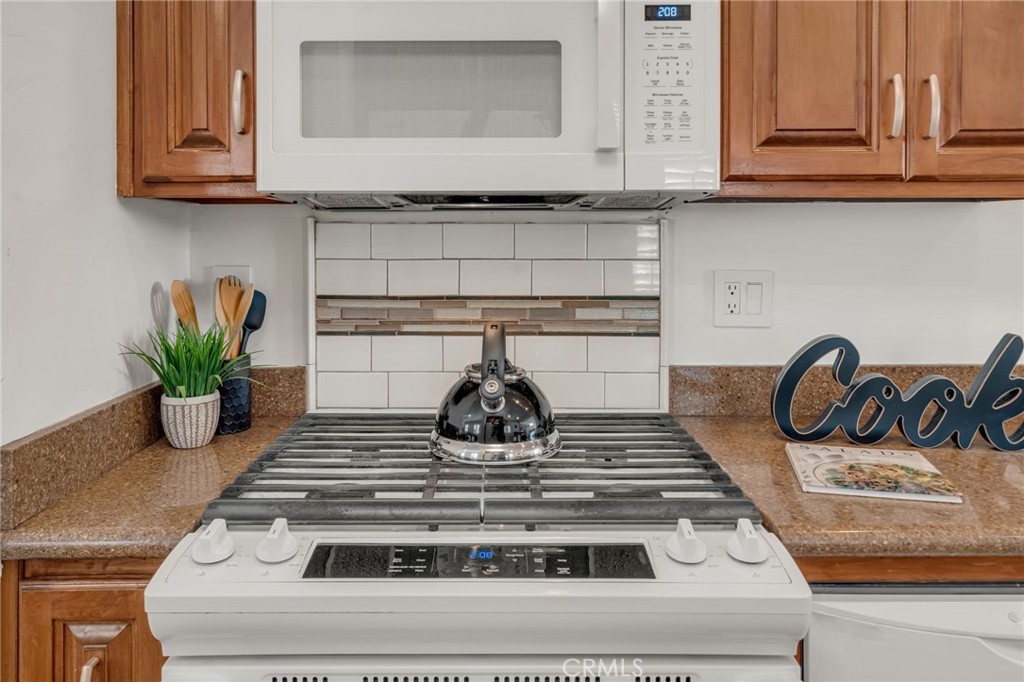 5142 West 142nd Street Hawthorne, CA 90250 - Photo 14 of 56 a kitchen with granite countertop stainless steel appliances and cabinets