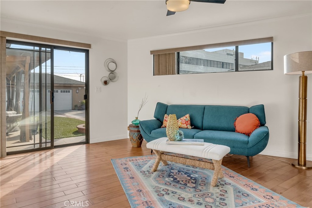 5142 West 142nd Street Hawthorne, CA 90250 - Photo 22 of 56 a living room with furniture and a floor to ceiling window