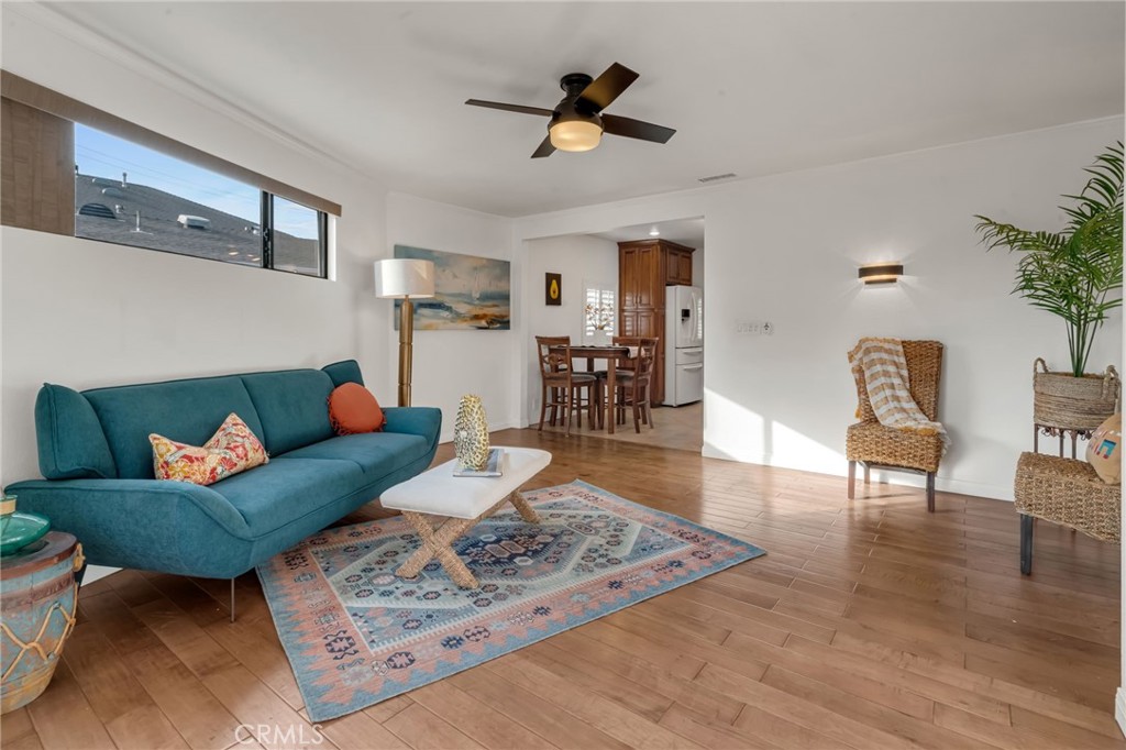 5142 West 142nd Street Hawthorne, CA 90250 - Photo 23 of 56 a living room with furniture and a wooden floor