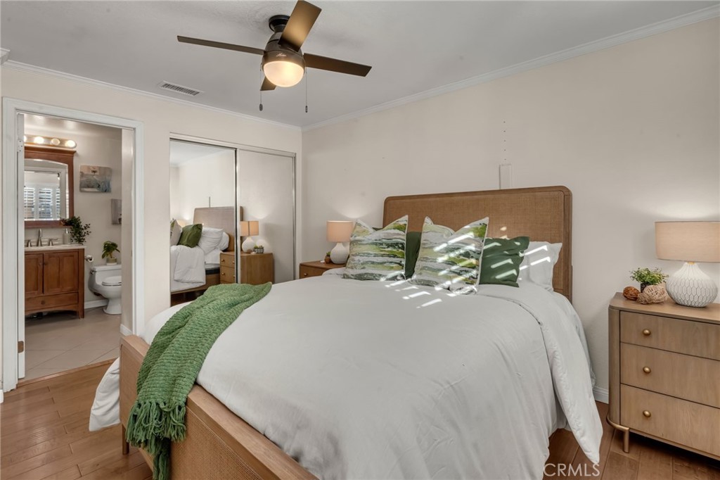 5142 West 142nd Street Hawthorne, CA 90250 - Photo 26 of 56 a spacious bedroom with a bed and a chandelier