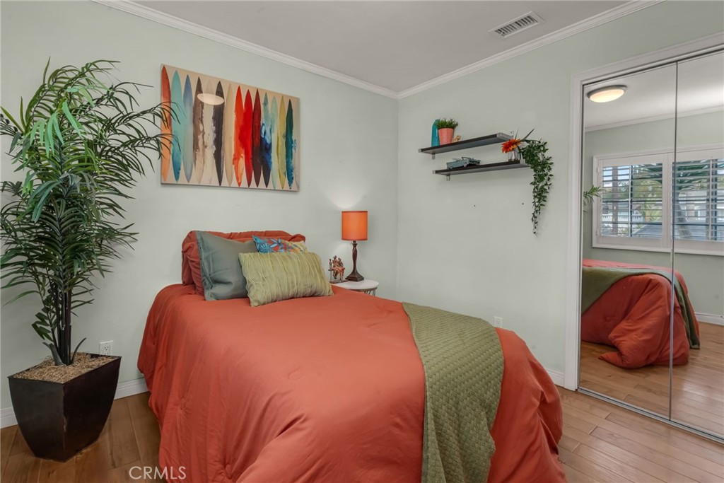 5142 West 142nd Street Hawthorne, CA 90250 - Photo 33 of 56 a bedroom with a bed and a painting on the wall