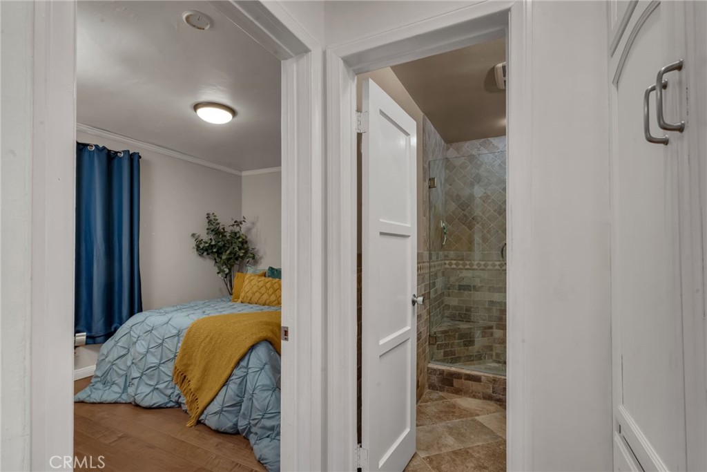 5142 West 142nd Street Hawthorne, CA 90250 - Photo 34 of 56 a bedroom with a bed and a potted plant