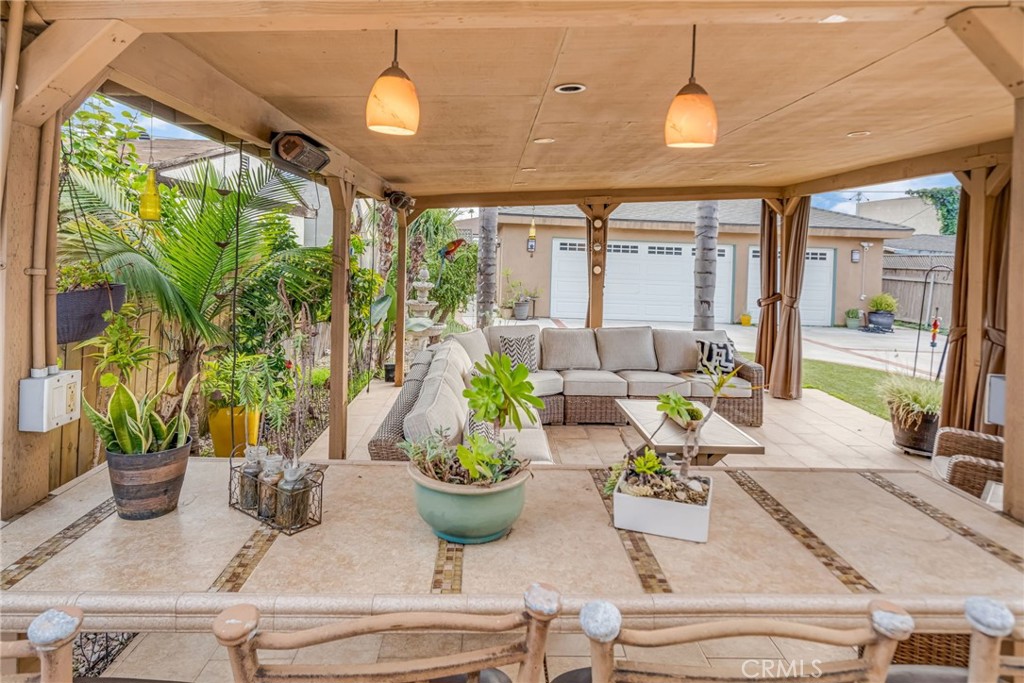 5142 West 142nd Street Hawthorne, CA 90250 - Photo 45 of 56 a dining room with furniture a potted plant and a chandelier