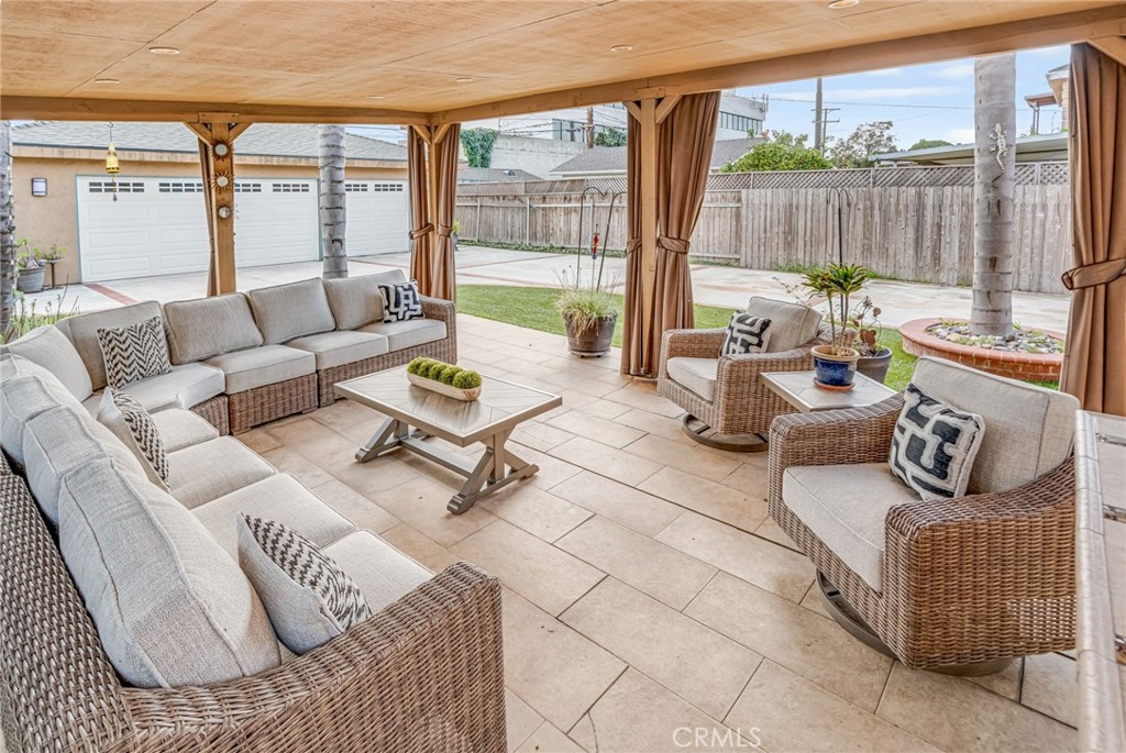 5142 West 142nd Street Hawthorne, CA 90250 - Photo 47 of 56 a living room with furniture and a floor to ceiling window