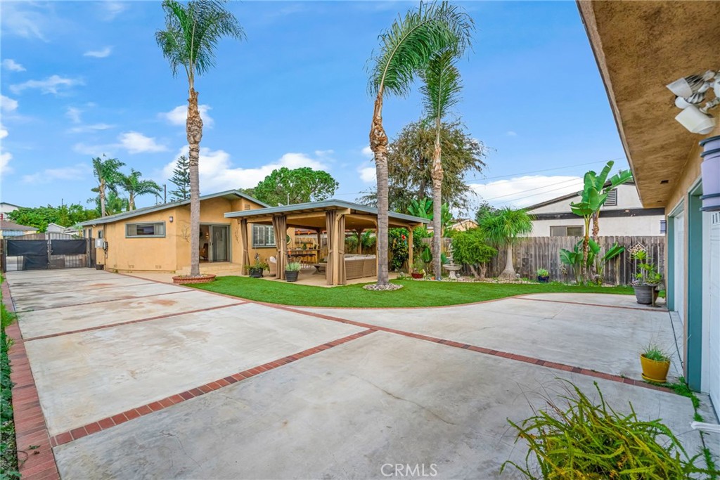 5142 West 142nd Street Hawthorne, CA 90250 - Photo 51 of 56 a view of a house with a yard and palm trees