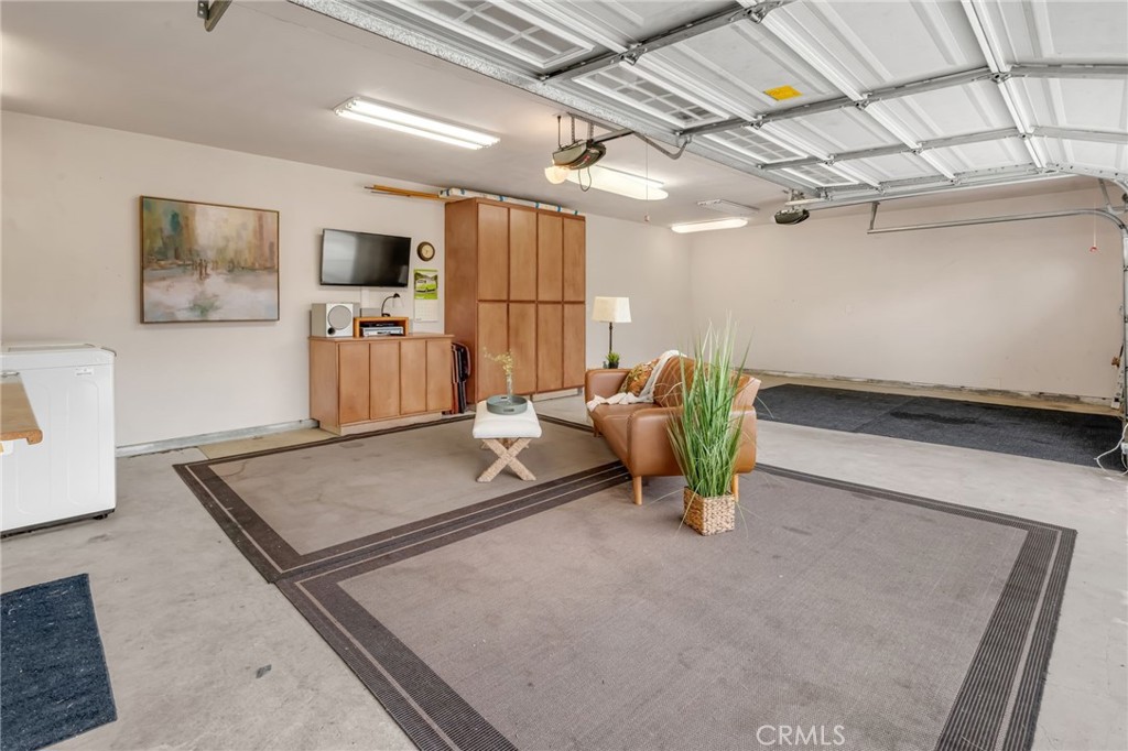 5142 West 142nd Street Hawthorne, CA 90250 - Photo 56 of 56 a living room with furniture and a flat screen tv