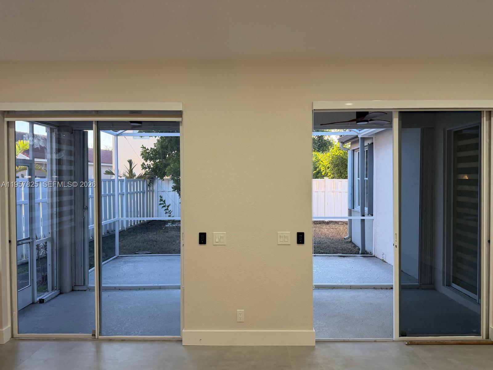 755 Falling Water Road Weston, FL 33326 - Photo 18 of 52 a view of a hallway with wooden floor and a living room
