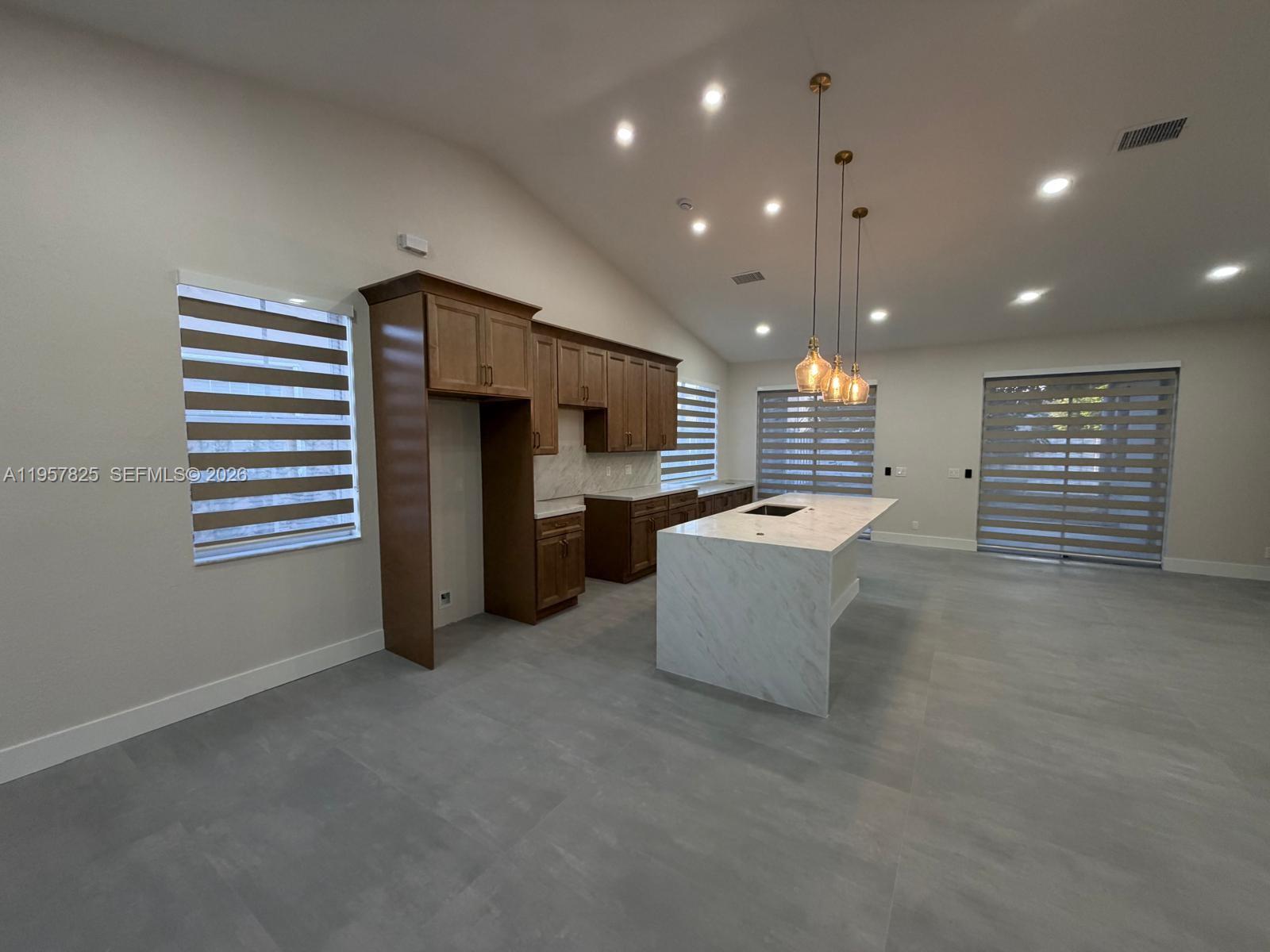 755 Falling Water Road Weston, FL 33326 - Photo 2 of 52 a room with furniture and a window