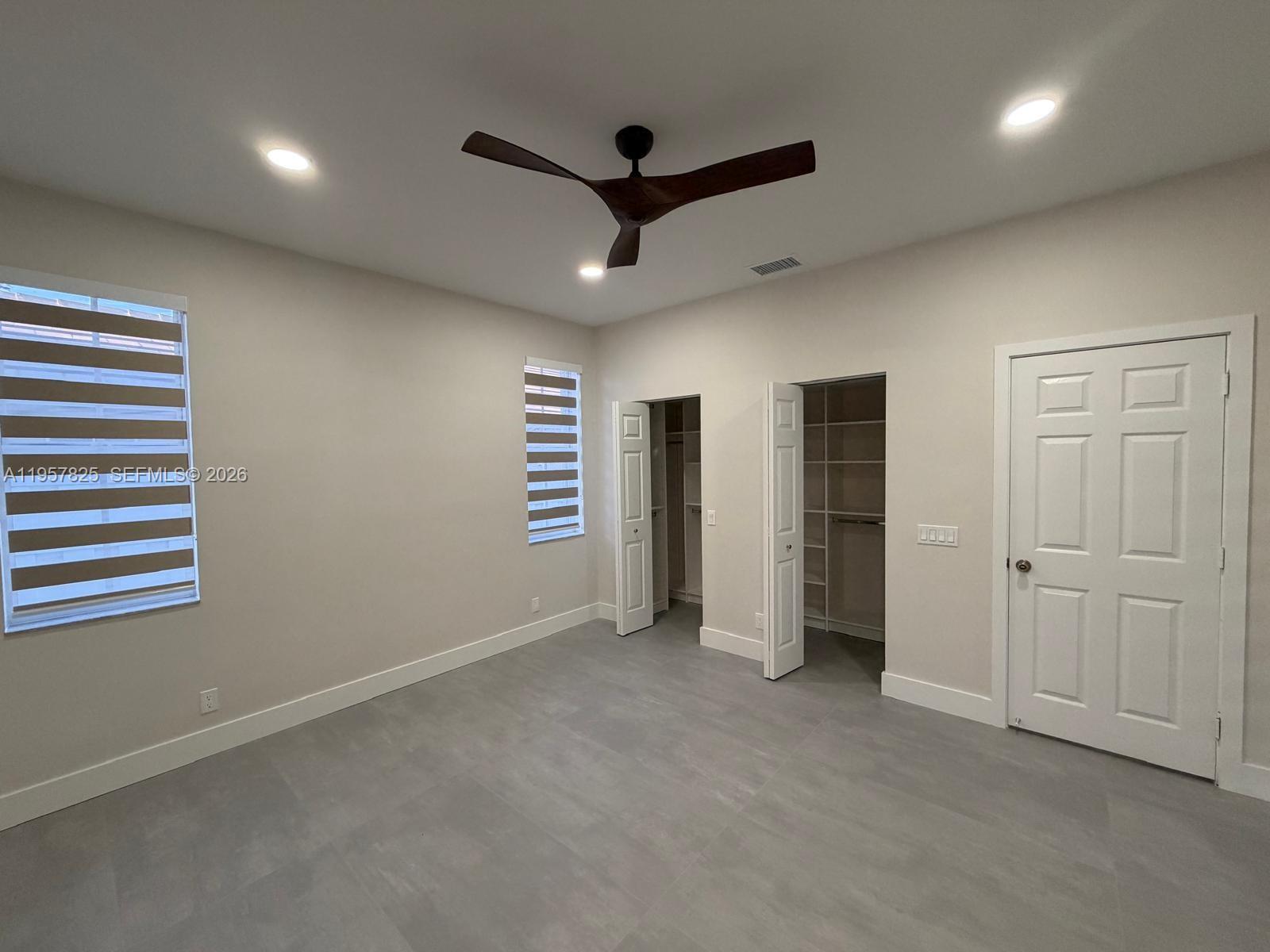 755 Falling Water Road Weston, FL 33326 - Photo 23 of 52 a view of empty room with ceiling fan