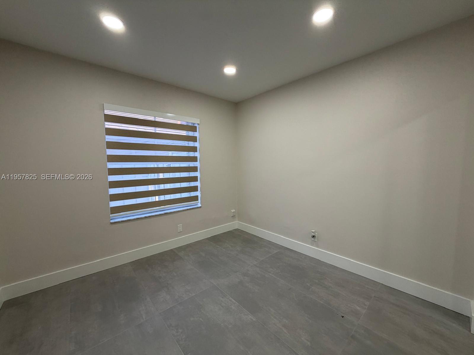 755 Falling Water Road Weston, FL 33326 - Photo 27 of 52 a view of empty room with a window