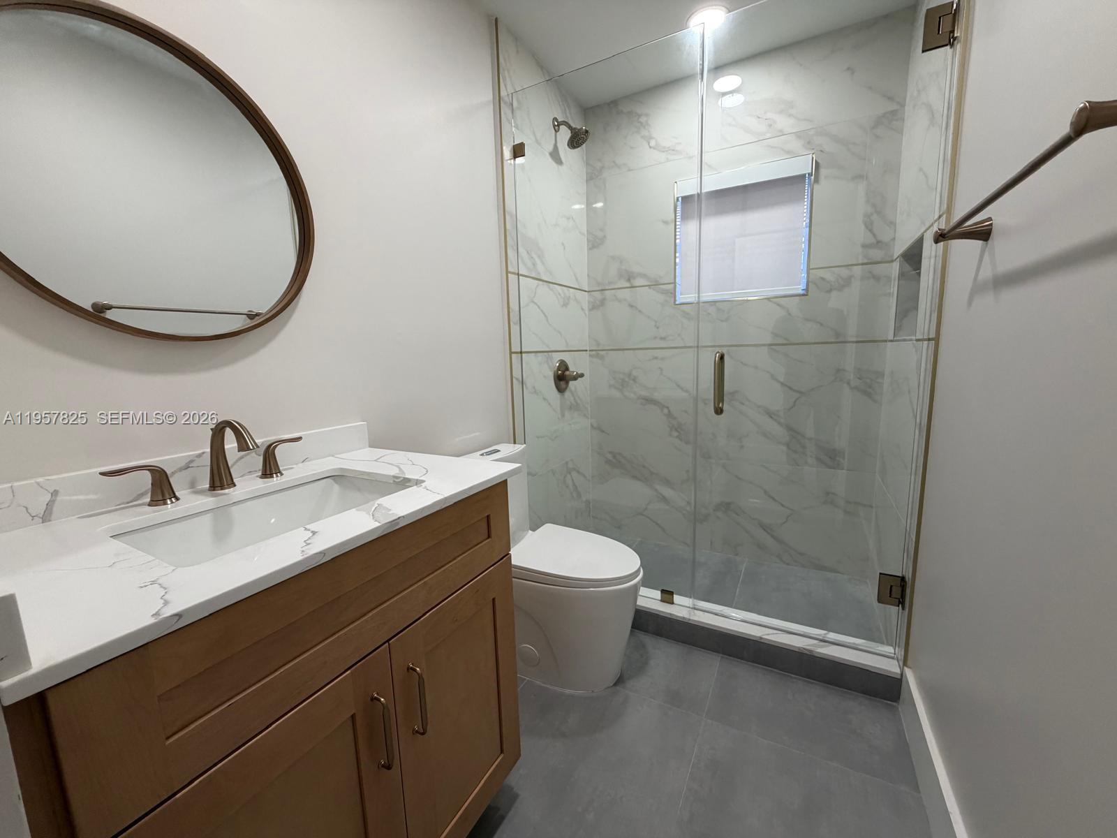 755 Falling Water Road Weston, FL 33326 - Photo 30 of 52 a bathroom with a granite countertop sink toilet and shower