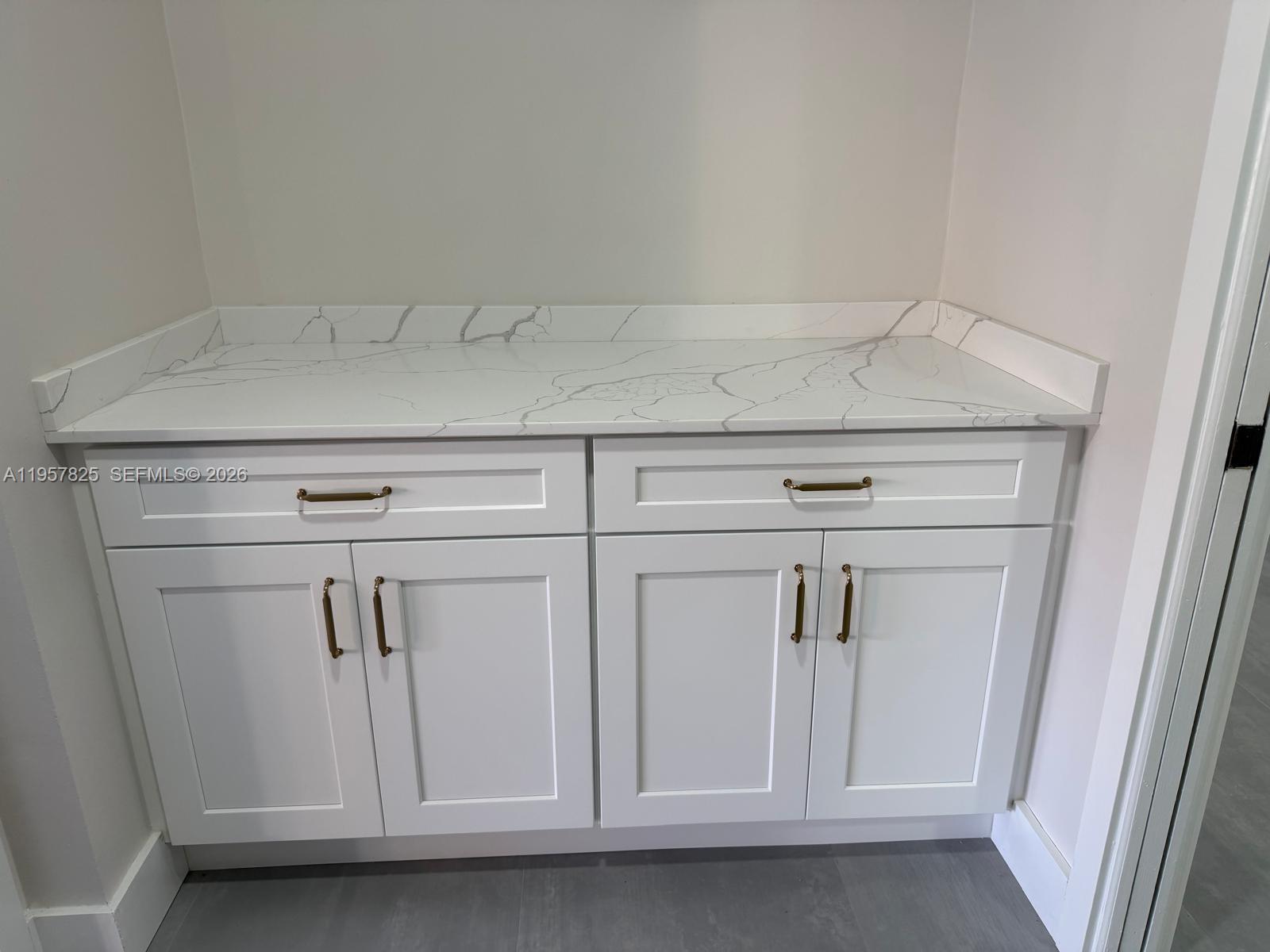 755 Falling Water Road Weston, FL 33326 - Photo 36 of 52 a view of white cabinets