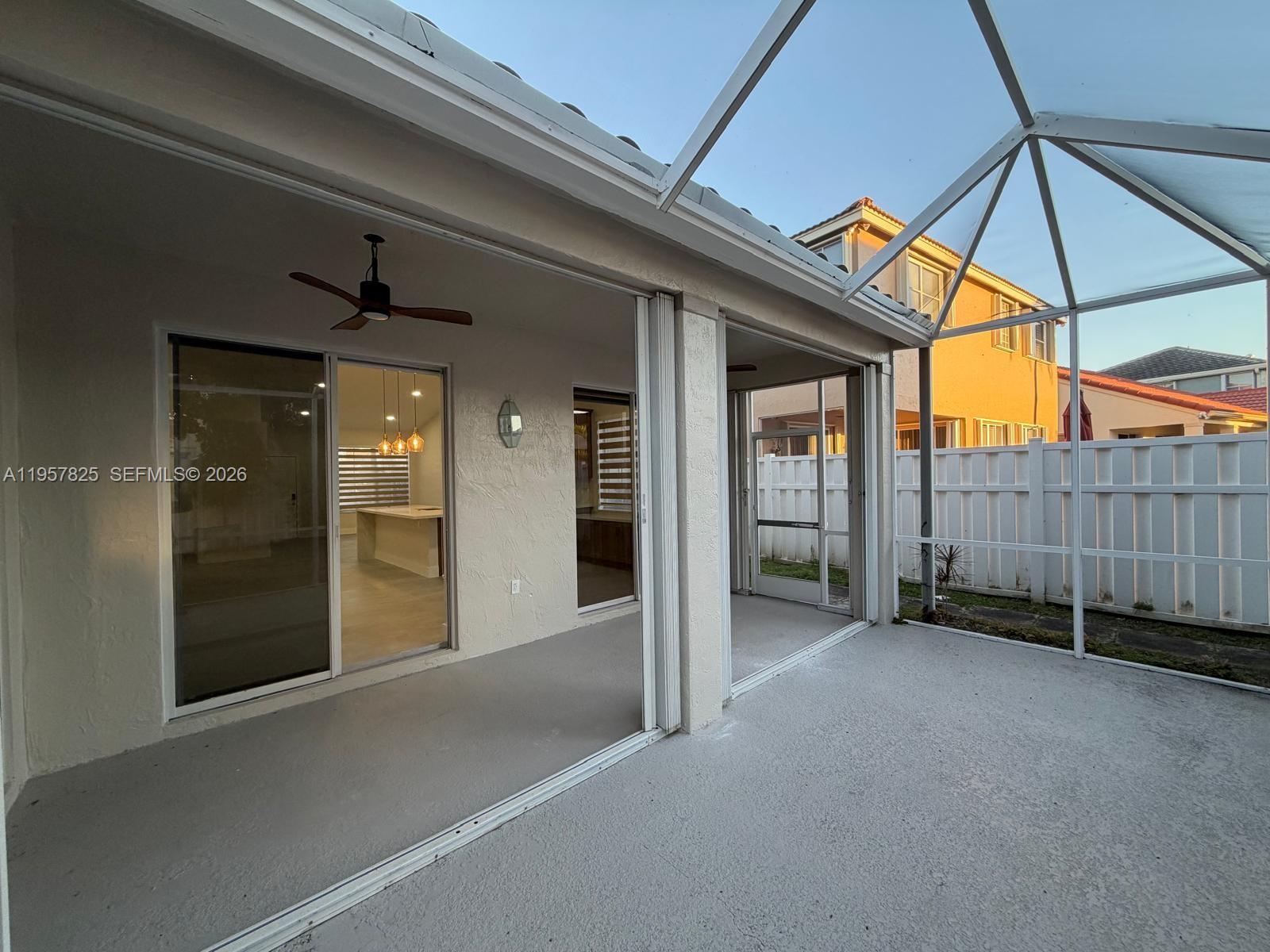 755 Falling Water Road Weston, FL 33326 - Photo 38 of 52 a view of a backyard with wooden fence