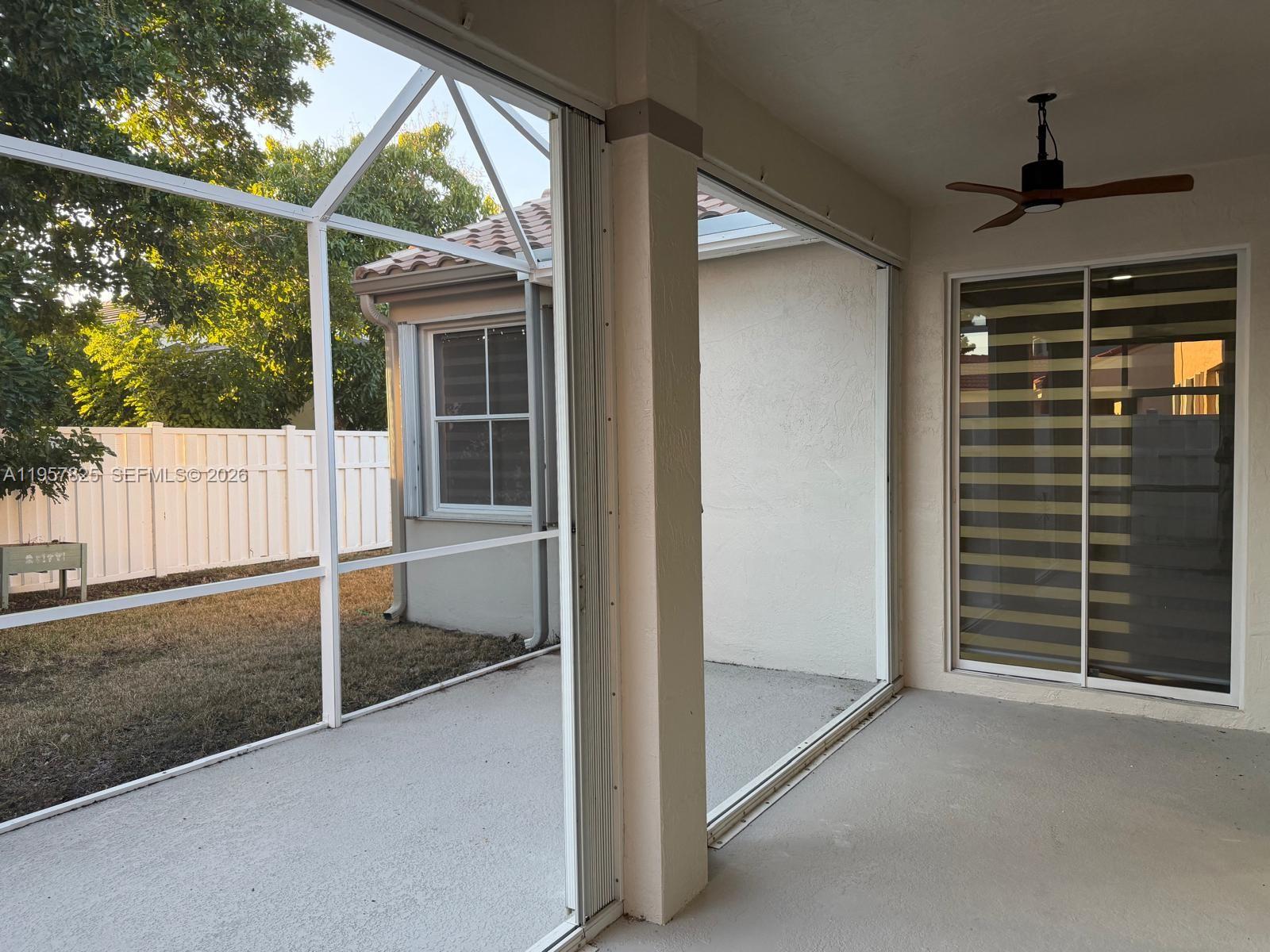 755 Falling Water Road Weston, FL 33326 - Photo 40 of 52 a view of porch with a swing