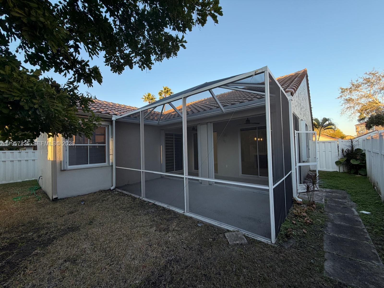 755 Falling Water Road Weston, FL 33326 - Photo 48 of 52 a view of backyard with large tree