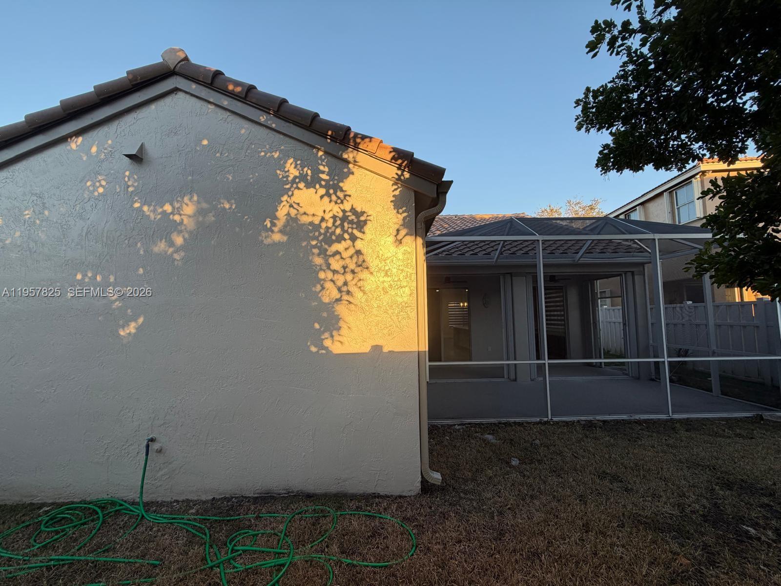 755 Falling Water Road Weston, FL 33326 - Photo 49 of 52 a front view of a house with plants