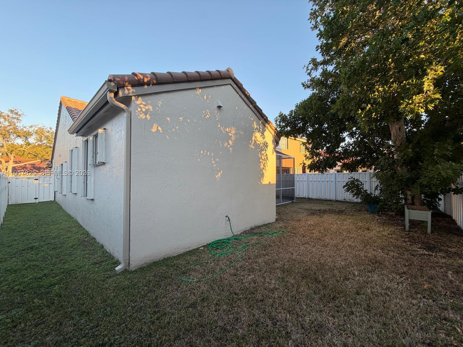 755 Falling Water Road Weston, FL 33326 - Photo 50 of 52 a view of a house with a yard