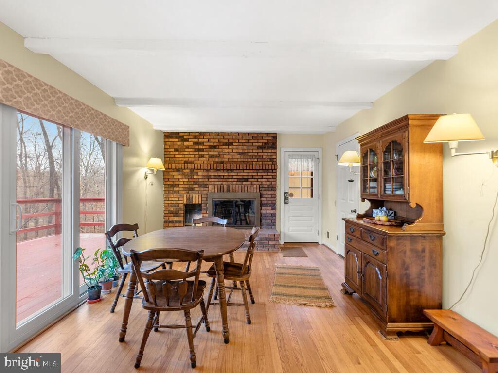 6014 Snowdens Run Road Sykesville, MD 21784 - Photo 16 of 56 Family room with wood burning fireplace