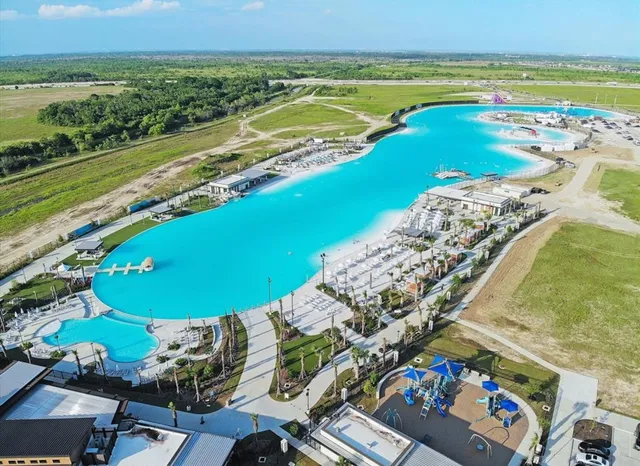 a aerial view of a house with backyard