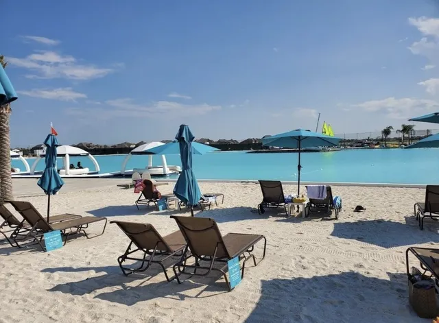 a view of a terrace with lawn chairs
