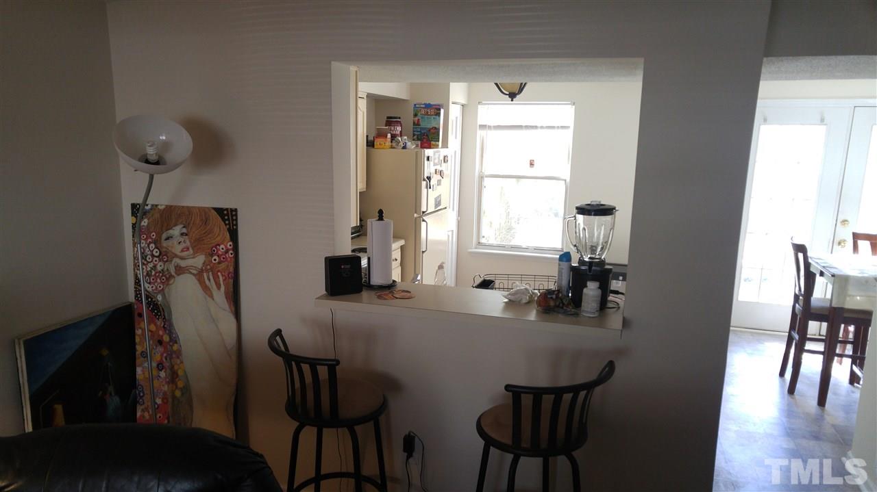 4311 Halliwell Drive Raleigh, NC 27606 - Photo 12 of 21 a view of a dining room with furniture and wooden floor