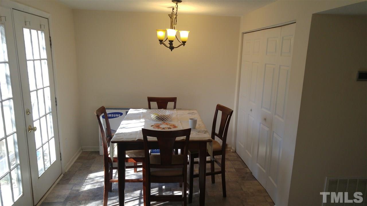 4311 Halliwell Drive Raleigh, NC 27606 - Photo 16 of 21 a view of a dining room with furniture and window